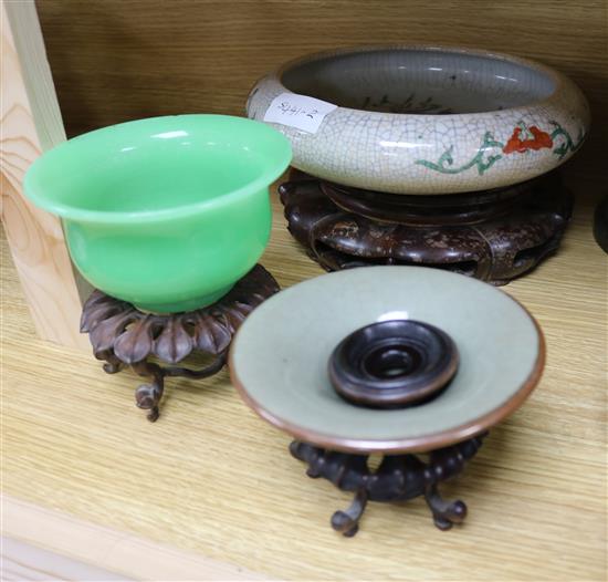 Three Chinese hardwood stands and three bowls